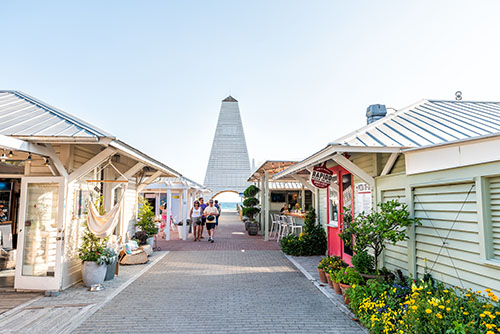 Al fresco dining at a 30A restaurant under twinkling lights during fall season